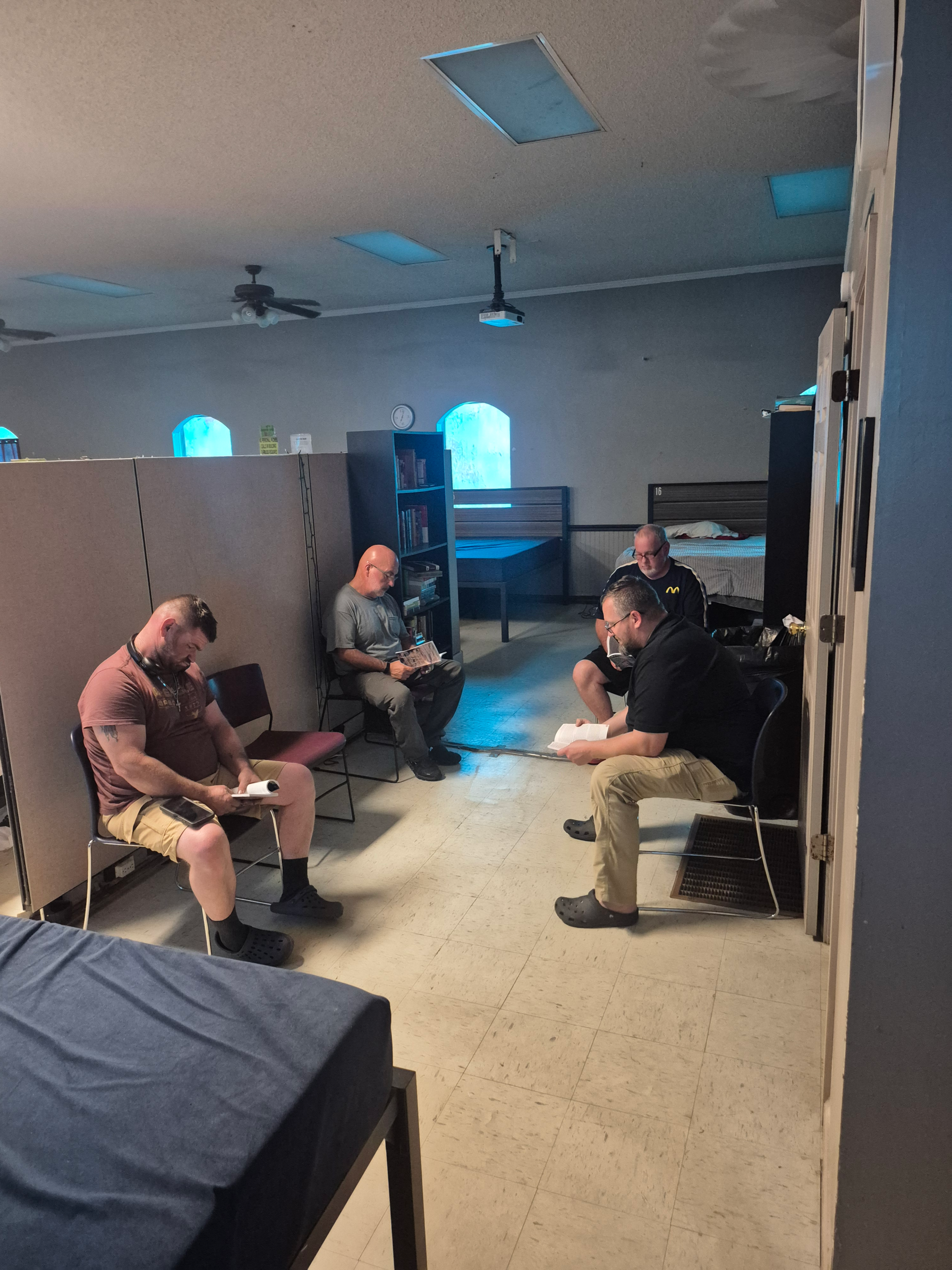 CREAA residents gathered in a circle for prayer and conversation